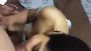 Cute girlfriend in bra giving blowjob to boyfriend