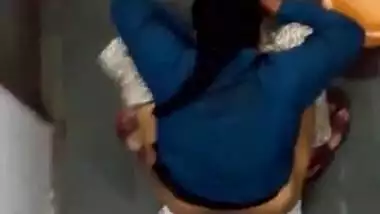 Indian girl changing pad in toilet