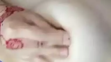 Desi female with tattooed hands receives pleasure touching chest