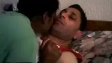 Young couple kissing in bedroom